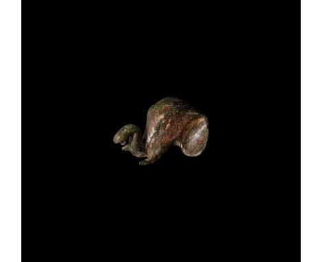 1st-2nd century AD. An elephant head mount or appliqué modelled in the half round, with s-curved trunk, incised hatched textu