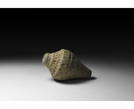9th-11th century AD. A small piriform ceramic vessel with short neck and domed lip, shallow circular and oval-shaped dimples 
