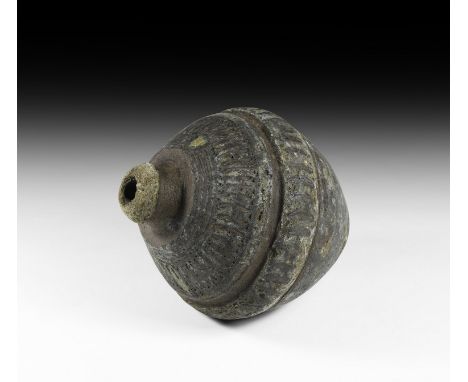 9th-11th century AD. A substantial hollow ceramic vessel, biconical in shape, intended to be filled with explosive liquid and