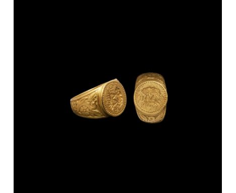 Late 16th-early 17th century AD. A substantial gold finger ring comprising a tapering hoop with reserved rosettes and trailin