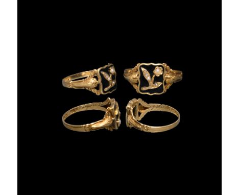 Hallmarked London 1835 AD. A gold mourning ring with grooved band expanding to ornate acanthus shoulders; the rectangular bez