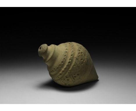 9th-11th century AD. A piriform ceramic vessel with tiered neck, domed lip and conical base, decorated around the shoulder an