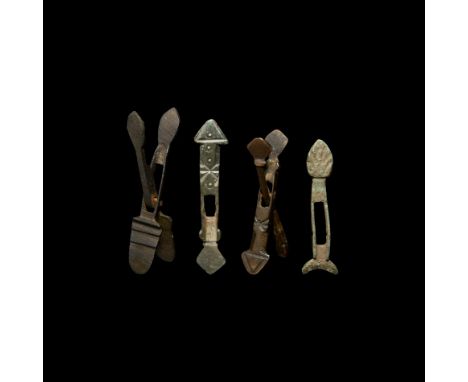7th-10th century AD. A mixed group of four coin balance tools and tool elements, including examples with decorative motifs. S