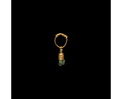 9th-12th century AD. A gold pendant with round-section hoop with coiled wire terminals, free-running pendant with coiled loop