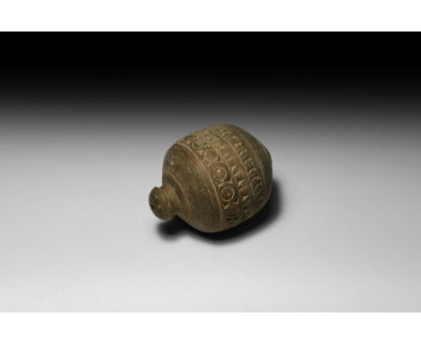 9th-11th century AD. A drum-shaped ceramic vessel with short neck, domed lip and conical base, medial band of impressed annul