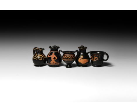 4th-3rd century BC. A mixed group of miniature blackware ceramic vessels of Magna Graecian (Apulian) workmanship, comprising: