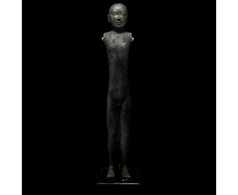 20th century AD. An unglazed Han style ceramic stick figure of a nude male with hair dressed in a top-knot, sockets to the sh