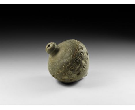 9th-11th century AD. A small piriform ceramic vessel with short neck, domed lip and conical base, decorated around the body w