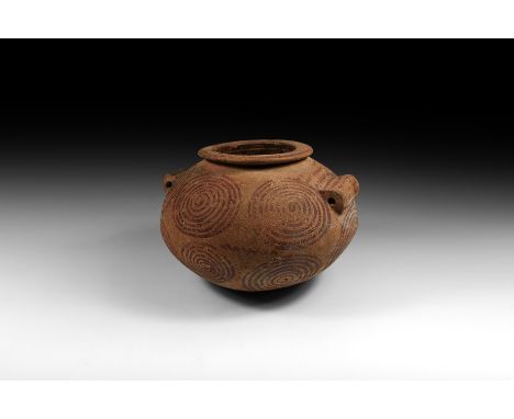 Predynastic Period, Naqada IIB-C, 3500-3200 BC. A squat globular ceramic jar with broad string-hole handles to the shoulders,