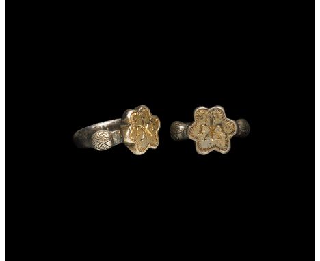 16th century AD. A silver ring with hoop of semi-circular section; each shoulder decorated with laurel leaves and other folia