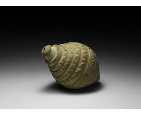 9th-11th century AD. A piriform ceramic vessel with tiered shoulder and neck, domed lip and conical base, the raised bands at