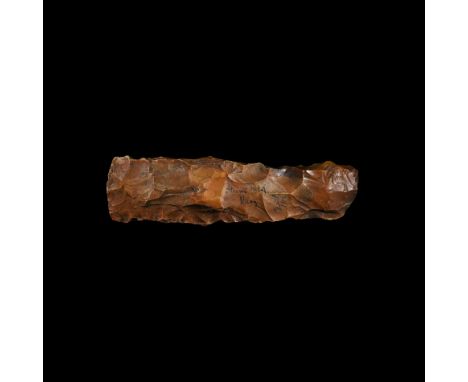 Neolithic, 7th-5th millennium BC. A knapped thick-butted axe in orange-brown flint with the convex cutting edge tapering slig