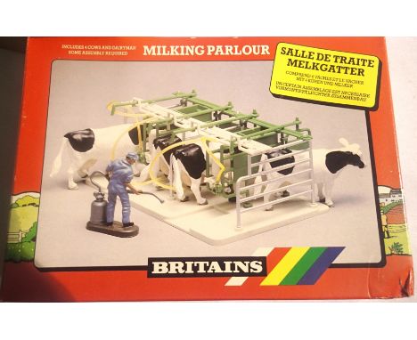 Three Britains 4710 milking parlour in excellent to near mint condition, in trade box, some storage wear. P&amp;P Group 1 (£1