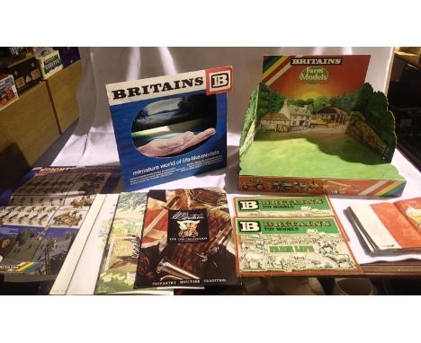 Two Britains card shop display stands as new/unused, with storage wear/creases and 2x window stickers, knights posters x2, st