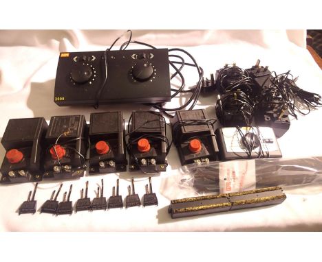 Seven Hornby controllers comprising: H&amp;M 2000 plus single x6, transformers x4, track power clips x8 and Gaugemaster wheel
