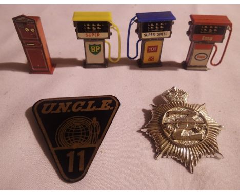 Man from uncle no11 badge plus Z cars badge, also three vintage petrol pumps and a Hornby O gauge ticket machine, and Esso Mr