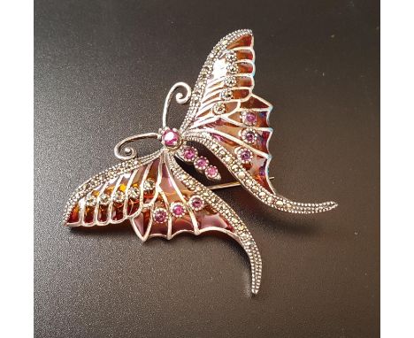 RUBY, MARCASITE AND ENAMEL BUTTERFLY BROOCHthe body formed with rubies, the wings divided into colourful sections and decorat