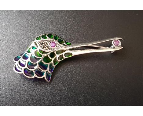 RUBY, MARCASITE AND ENAMEL SILVER HUMMINGBIRD BROOCHwith ruby eye in marcasite surround and a further ruby held in the beak, 