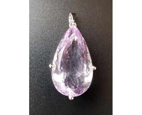 IMPRESSIVE AMETHYST SOLITAIRE PENDANTthe large pear cut amethyst with faceted underside and measuring approximately 2.7cm x 1