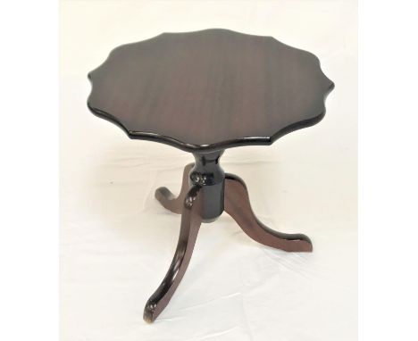 MAHOGANY TRIPOD OCCASIONAL TABLEwith a shaped circular top on a turned column with three outswept supports, 49.5cm high 