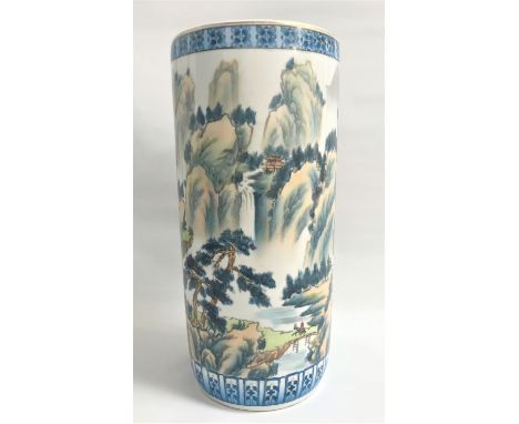 CHINESE POTTERY STICK STANDof cylindrical form decorated with a mountain scene, horse and rider and boats, bearing a characte