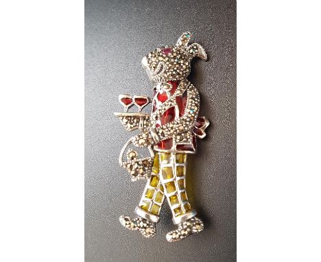 RUBY, MARCASITE AND ENAMEL DECORATED SILVER RABBIT BROOCHthe rabbit modelled as a cocktail waiter, with ruby eye, red top and