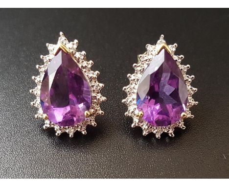 PAIR OF AMETHYST AND DIAMOND CLUSTER STUD EARRINGSeach the pear cut amethysts approximately 2.5cts, in illusion surrounds set