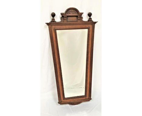 EARLY 20TH CENTURY LARGE OAK MIRRORwith a shaped and carved pediment flanked by globe finials above a tapering beveled plate,