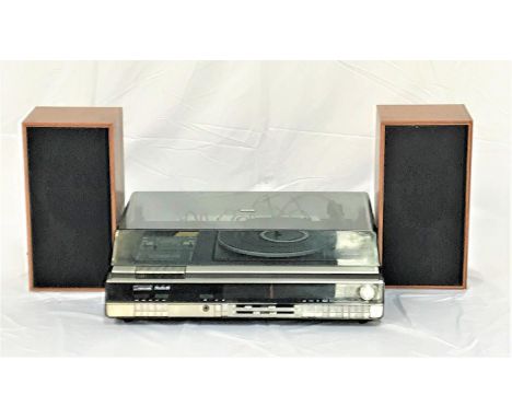 FERGUSON STUDIO 15 MUSIC CENTREwith a smoked plastic lift up lid revealing a record deck and cassette player with a radio tun