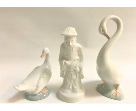 NAO PORCELAIN GOOSE FIGURINEstanding upright, 20cm high, another Nao goose figurine, 12.5cm high; and a blanc de chine style 