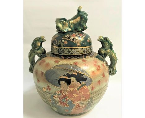 LARGE JAPANESE TWIN HANDLED VASEwith a circular lid decorated with fans and flowers and a dog finial, the vase decorated with