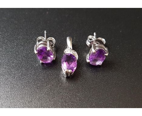 MATCHED SUITE OF AMETHYST JEWELLERY comprising a pair of oval cut amethyst stud earrings, the amethysts on each approximately