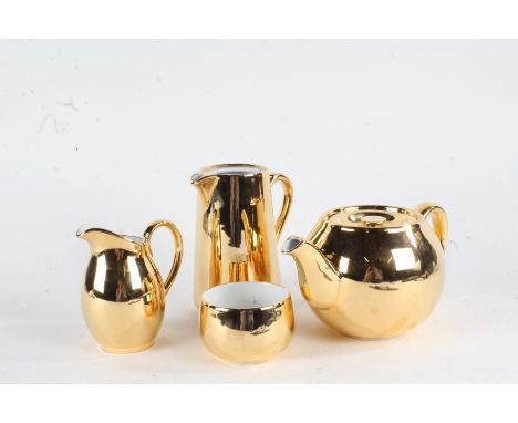 Royal Worcester gilt tea set, consisting of teapot, hot water jug, milk jug and sugar bowl (4)