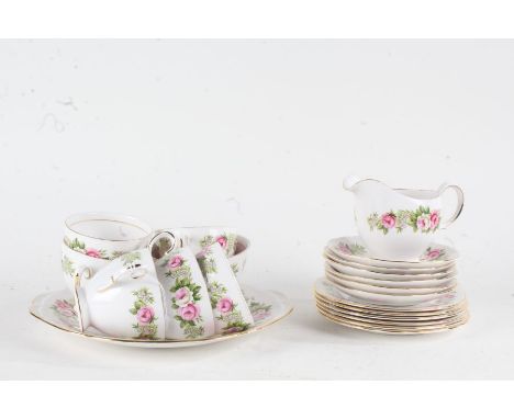 Quantity of Colclough rose tea ware, comprising six each cups, saucers, and side plates, cream jug, sugar bowl and serving pl