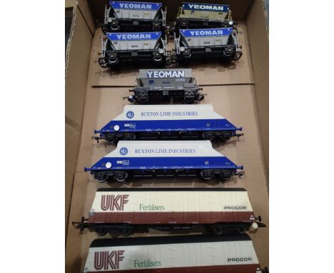 Nine wagons; Lima Procor x2 and Yeoman x1, Hornby Yeoman x4, Bachmann Buxton Lime x2 mostly in very good condition, unboxed. 