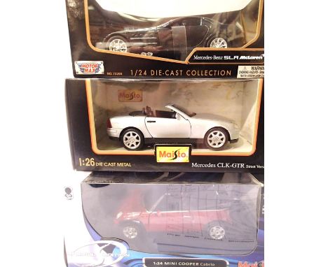 Three 1:24 scale cars; Maisto Mini Cooper and Mercedes CLK, and Motor Max Mercedes Benz Mclaren, excellent condition, boxed. 