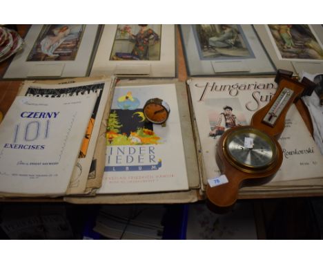 A aneroid barometer and a vintage metal Oris Alarm clock.