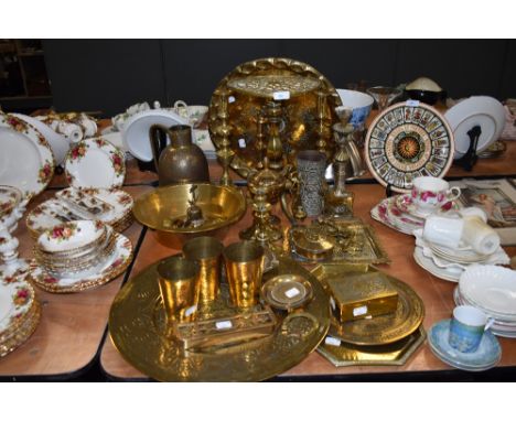 A large lot of vintage brass, including platters and chargers, boxes, jugs, bowls a door knocker and water jug with Islamic t