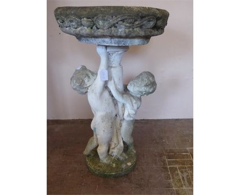 A Vintage Stone Bird Bath depicting Cherubs, approx 90 cm.