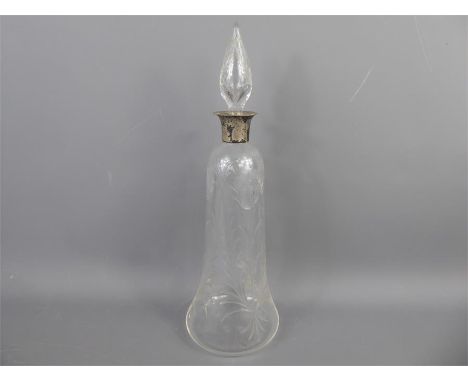 An Antique Cut Glass Silver Collared Decanter depicting a flower.&nbsp;