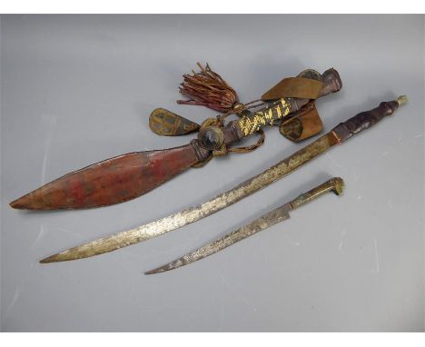 An Antique Sudanese Kaskara Sword, the sword housed within a woven scabbard together with an antique Algerian Flyssa, the cur
