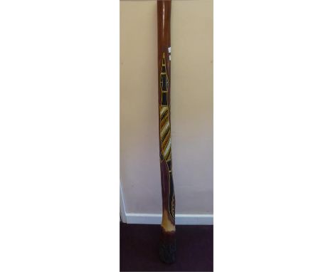 An Australian Aboriginal Didgeridoo, carved with an alligator, 152 cms long, together with a painted emu egg.(2)