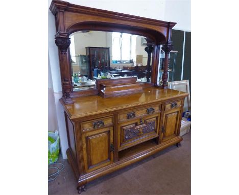 An Edwardian Pollard Oak Sideboard, the sideboard having canopied top with a pair of reeded Corinthian column supports to eit