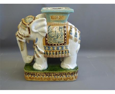 A Ceramic Green, White and Mustard Glazed Plant Stand, in the form of an Mughal Indian Elephant, approx 50 x 50 cms.