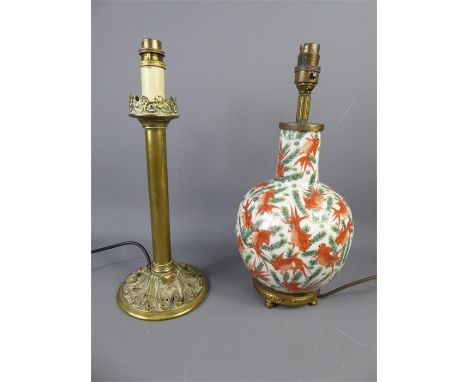 A Chinese Porcelain Lamp Base, painted with gold fish, together with a decorative brass lamp base. (2)