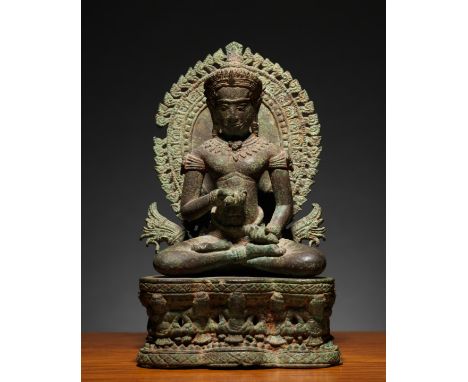 STATUETTE DE VAJRAPANI EN ALLIAGE DE CUIVRECambodge, style d'Angkor Vat, XIIe siècleA COPPER ALLOY FIGURE OF VAJRAPANICambodi