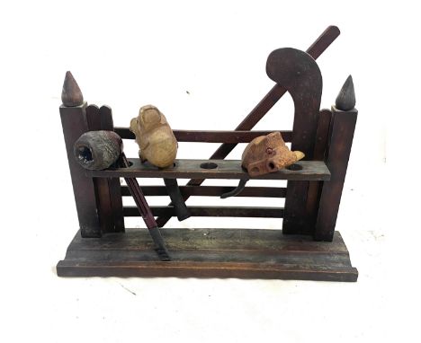 Antique pipe stand and pipes 