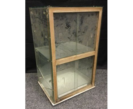 A counter top Apothecary display/sterilising cabinet, milk glass ridged base, sliding doors, shelf interior, 32cm high, 60cm 