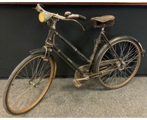 A Vintage Raleigh ladies' bicycle, 'The All Steel Bicycle', with original battery powered electric lights, and sprung leather