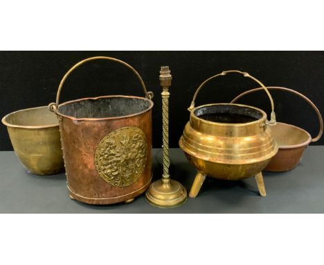 A 19th century copper and brass coal bucket, embossed shield plaque 300cm high x 32cm diameter; brass tripod cauldron, preser